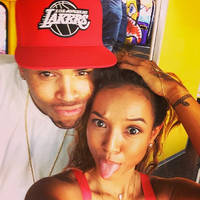 Chris Brown shoves female fan who tries to kiss him while with girlfriend Karrueche Tran - WATCH